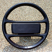 4 spoke leather wrapped steering wheel